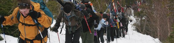 Skiers hiking up the Tuckerman Ravine trail